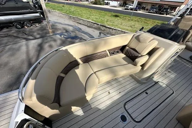 Slide: The Image of 2024 Silver Wave 2610 SW7 JS boat with luxurious beige seating and wood accents. - 10