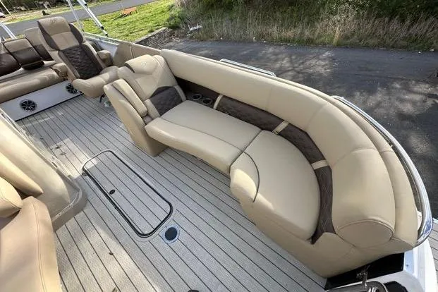 Slide: The Image of Luxurious seating on 2024 Silver Wave 2610 SW7 JS boat, featuring beige upholstery and spacious layout. - 11