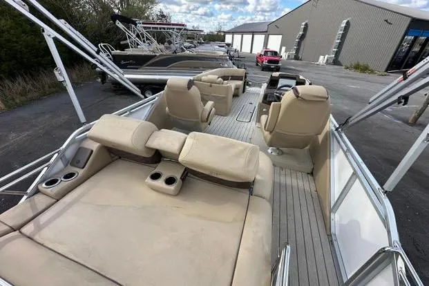 Slide: The Image of 2024 Silver Wave 2610 SW7 JS pontoon boat with beige seating and spacious deck. - 13