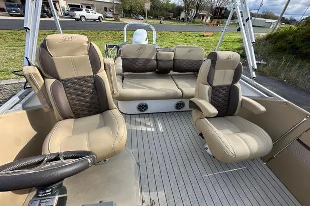 Slide: The Image of 2024 Silver Wave 2610 SW7 JS boat interior with plush seating and modern design. - 15