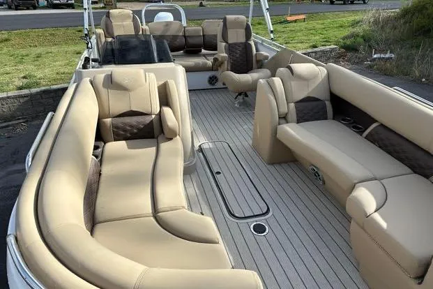 Slide: The Image of 2024 Silver Wave 2610 SW7 JS boat interior with luxurious beige seating and spacious layout. - 3