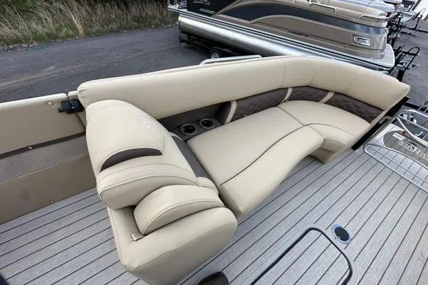Slide: The Image of 2024 Silver Wave 2610 SW7 JS boat with luxurious beige seating and cup holders. - 5