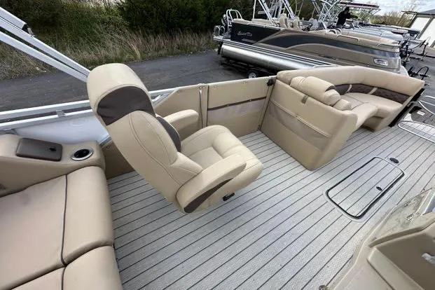 Slide: The Image of 2024 Silver Wave 2610 SW7 JS boat interior with beige seating and sleek design. - 6