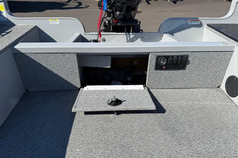 Slide: The Image of 2024 Smoker Craft Freedom 180 TL boat interior with open storage compartment. - 14