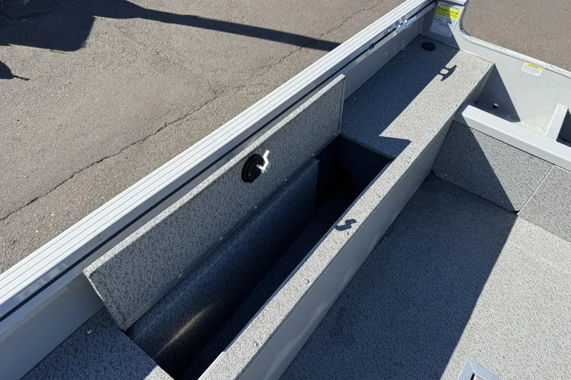 Slide: The Image of 2024 Smoker Craft Freedom 180 TL boat interior with open storage compartment. - 15