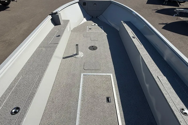 Slide: The Image of 2024 Smoker Craft Freedom 180 TL boat interior with spacious deck and storage compartments. - 22