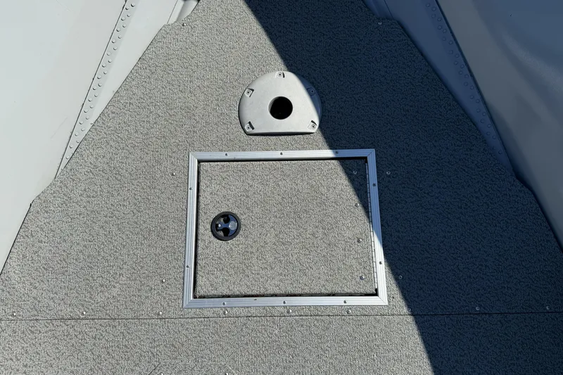 Slide: The Image of 2024 Smoker Craft Freedom 180 TL boat deck with storage hatch and seat base. - 28