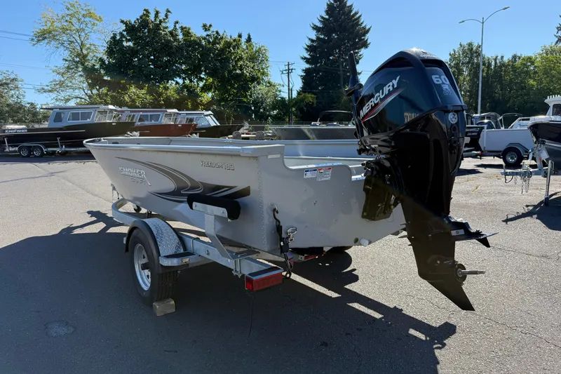 Slide: The Image of 2024 Smoker Craft Freedom 180 TL boat with Mercury 60 HP engine on trailer. - 5