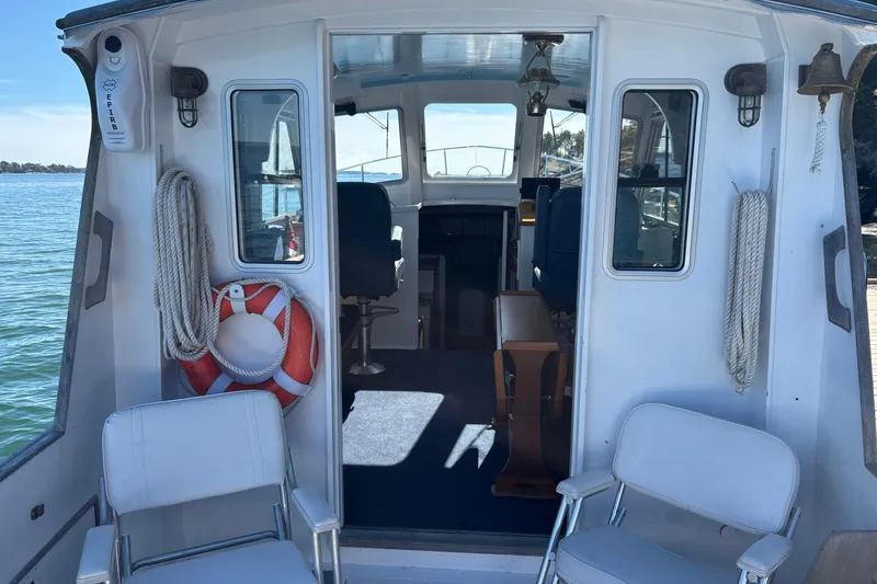 Slide: The Image of Interior view of a 1985 Jarvis Newman 36 boat with seating and nautical equipment. - 14
