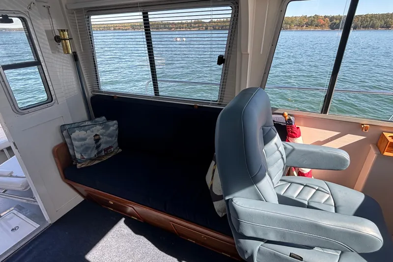 Slide: The Image of Interior of 1985 Jarvis Newman 36 boat with seating and scenic water view. - 25