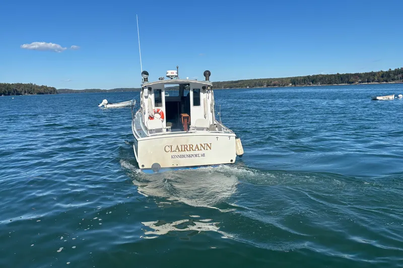 Slide: The Image of 1985 Jarvis Newman 36 boat "CLAIRANN" cruising on a clear blue lake. - 4