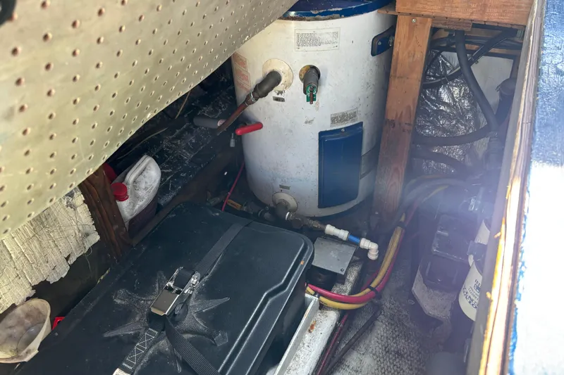 Slide: The Image of Engine compartment of a 1985 Jarvis Newman 36 boat, showing equipment and wiring. - 53