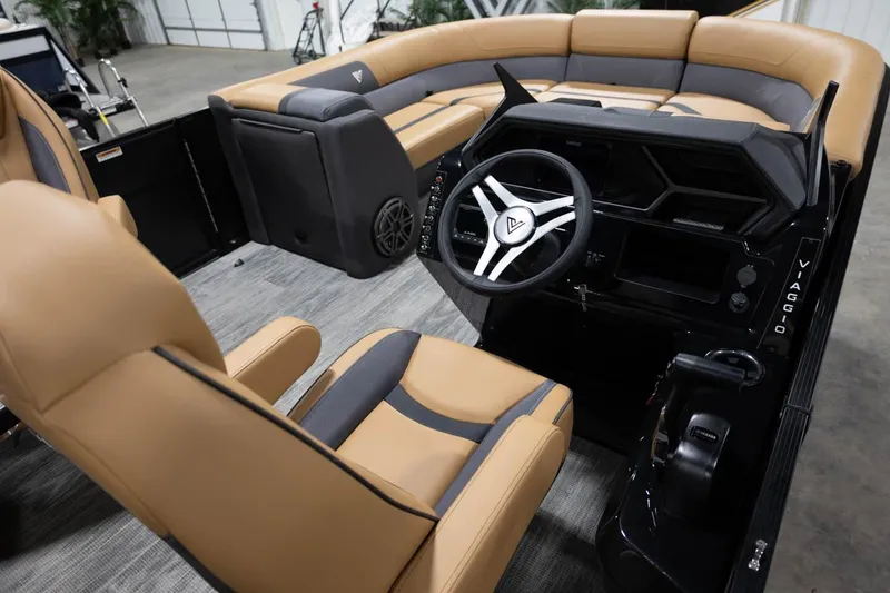 Slide: The Image of Manufacturer Provided Image: 2024 Viaggio Lago X-Q boat interior with tan and gray seating, modern steering console. - 12