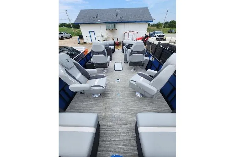 Slide: The Image of 2024 Viaggio Lago X22Q pontoon boat interior with modern seating and spacious layout. - 2
