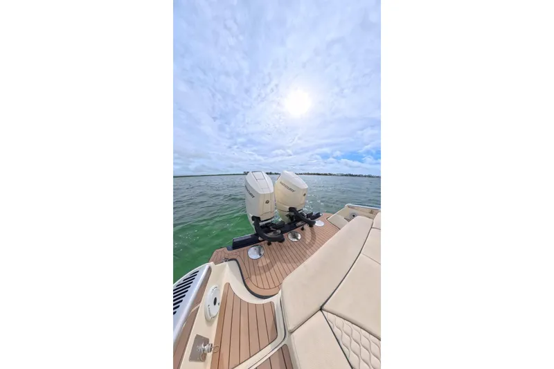 Slide: The Image of 2024 Chris-Craft Launch 35 GT boat with twin Mercury engines on open water. - 17