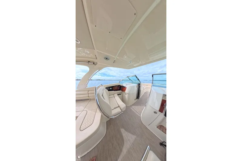 Slide: The Image of Luxurious interior of 2024 Chris-Craft Launch 35 GT boat with elegant seating and ocean view. - 24