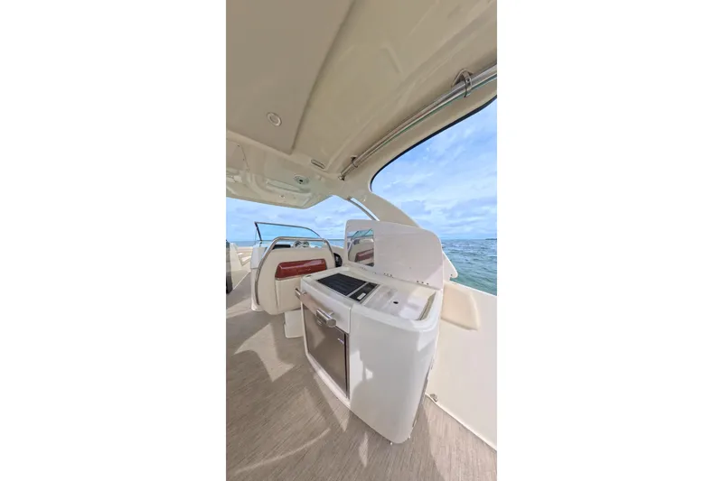 Slide: The Image of 2024 Chris-Craft Launch 35 GT interior with ocean view, featuring sleek design and modern amenities. - 28