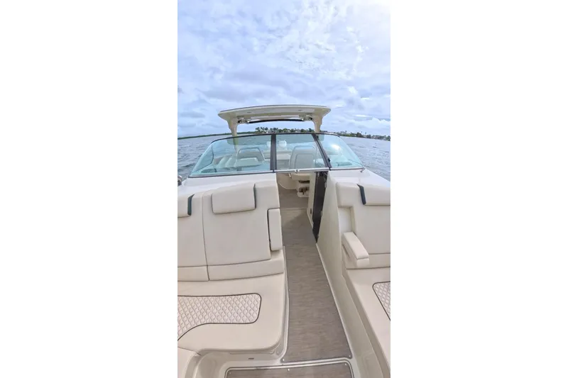 Slide: The Image of 2024 Chris-Craft Launch 35 GT boat interior with beige seating and open water view. - 29