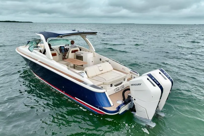 Slide: The Image of 2024 Chris-Craft Launch 35 GT boat on open water, featuring sleek design and powerful Mercury engines. - 3