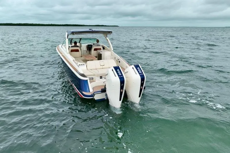 Slide: The Image of 2024 Chris-Craft Launch 35 GT boat on open water, showcasing dual engines. - 4