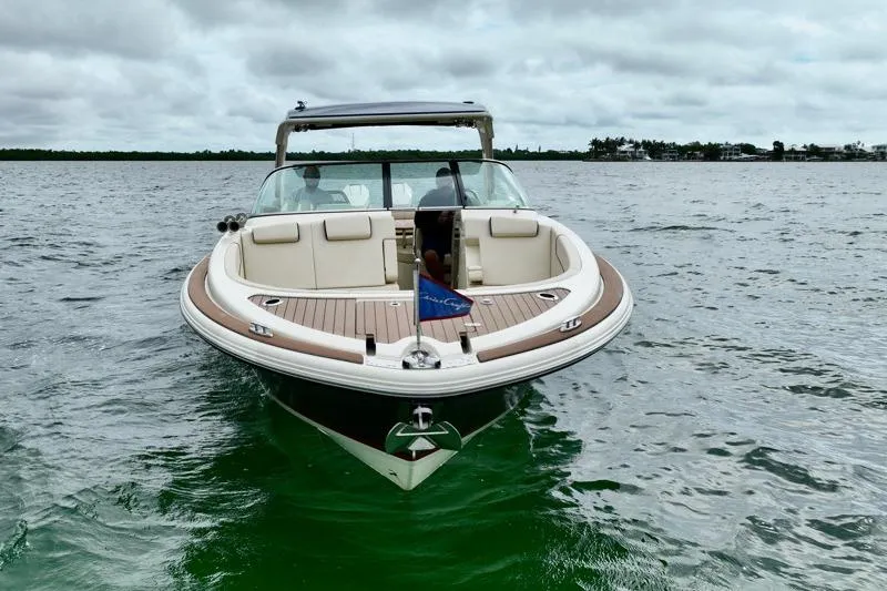 Slide: The Image of 2024 Chris-Craft Launch 35 GT boat on water, showcasing elegant design and luxury features. - 6