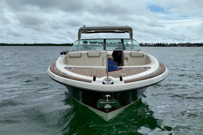 Slide: The Image of 2024 Chris-Craft Launch 35 GT boat on water, showcasing elegant design and luxury features. - 8