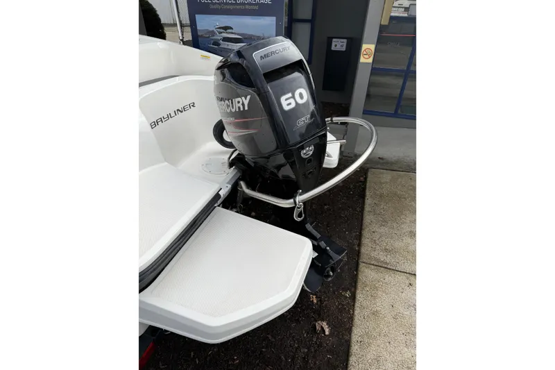 Slide: The Image of 2019 Bayliner Element E16 with Mercury 60 outboard motor, docked outdoors. - 7