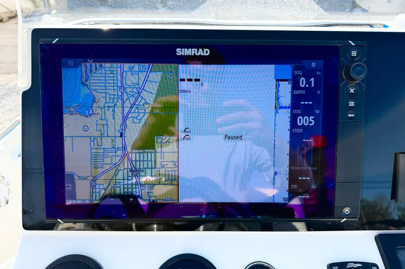 Slide: The Image of Simrad navigation display on 2020 Skeeter SX230 boat, showing map and data. - 13