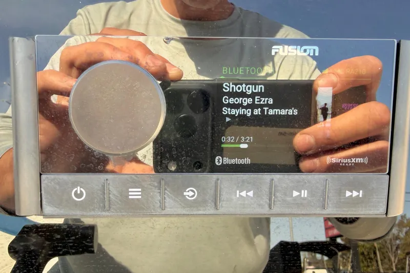 Slide: The Image of Fusion stereo displaying "Shotgun" by George Ezra on a Skeeter SX230 boat, 2020 model. - 16