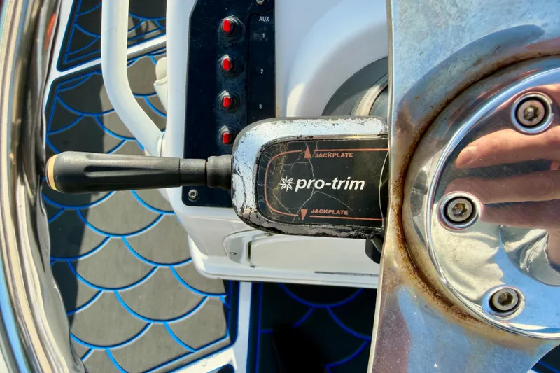 Slide: The Image of Close-up of 2020 Skeeter SX230 boat steering wheel with Pro-Trim control lever. - 17