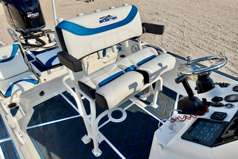 Slide: The Image of 2020 Skeeter SX230 boat interior with steering console and seating, featuring Yamaha 250 engine. - 18