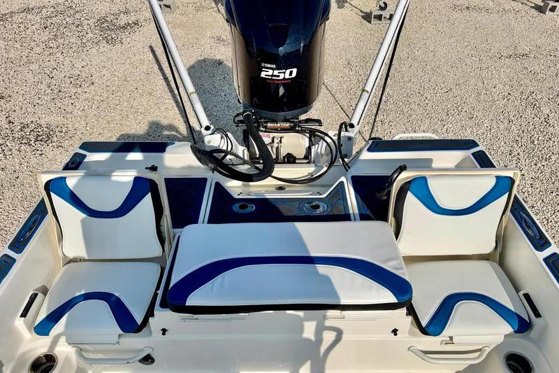 Slide: The Image of 2020 Skeeter SX230 boat interior with Yamaha 250 engine, featuring blue and white seating. - 21