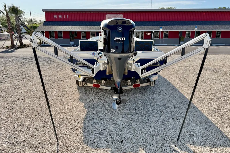 Slide: The Image of 2020 Skeeter SX230 boat with Yamaha 250 engine, parked on gravel. - 27