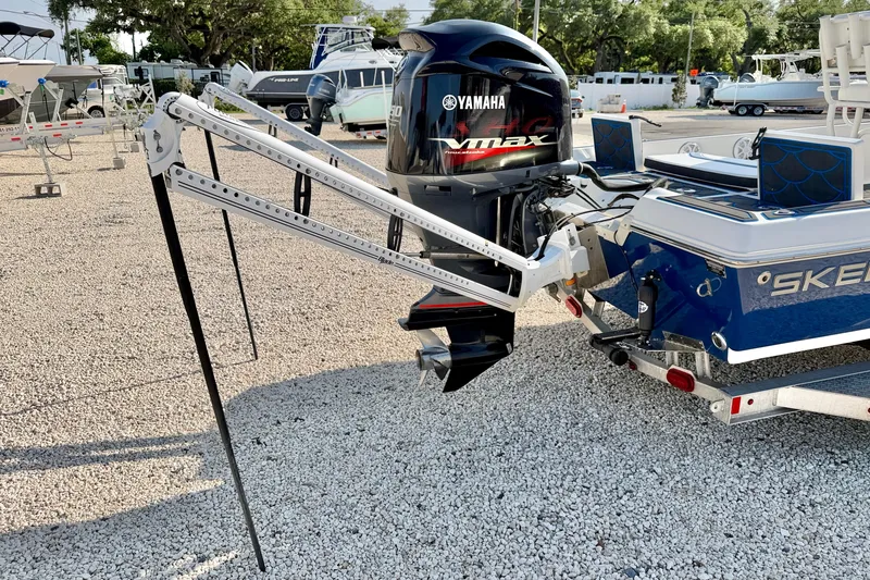 Slide: The Image of 2020 Skeeter SX230 boat with Yamaha VMAX engine on a gravel lot. - 28