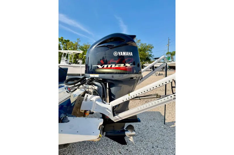 Slide: The Image of 2020 Skeeter SX230 with Yamaha VMAX outboard engine, parked on gravel. - 31