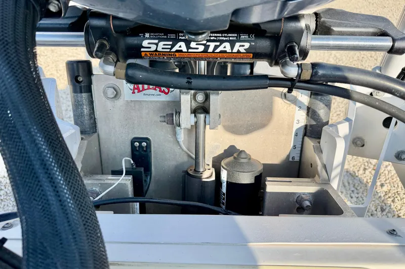 Slide: The Image of 2020 Skeeter SX230 boat steering mechanism with SeaStar hydraulic system. - 32