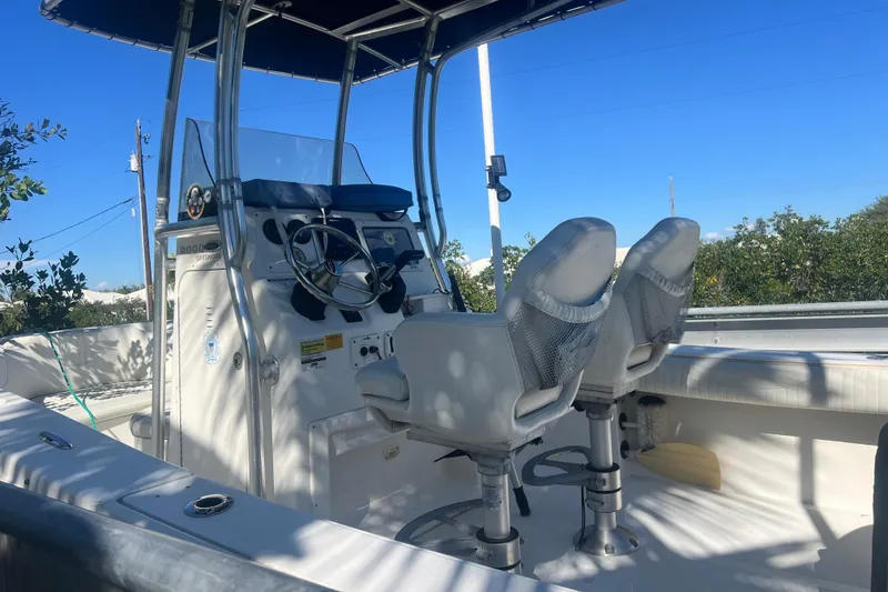 Slide: The Image of 2008 NauticStar 2000 Offshore boat interior with dual seats and steering console. - 3