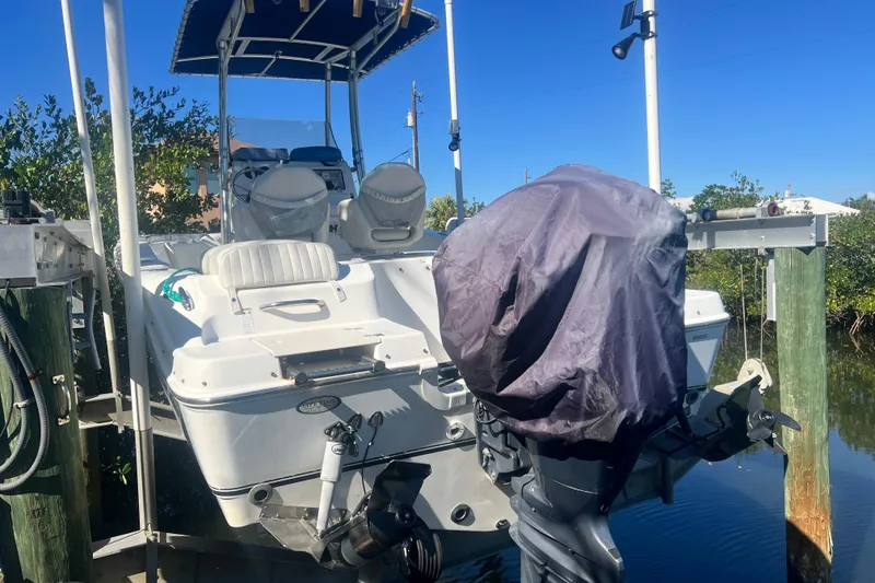 Slide: The Image of 2008 NauticStar 2000 Offshore boat docked with covered outboard motor. - 6