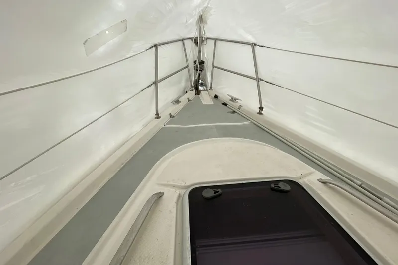 Slide: The Image of Interior view of a 1999 Hunter 380 sailboat under a protective cover. - 16