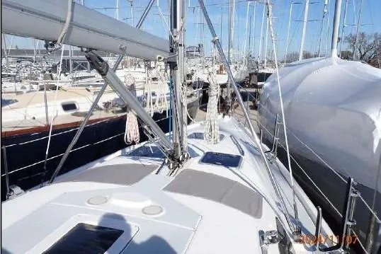 Slide: The Image of Hunter 380 sailboat from 1999 docked among other boats in a marina. - 18
