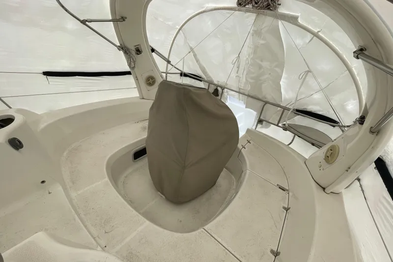 Slide: The Image of Interior of a 1999 Hunter 380 sailboat cockpit with covered steering wheel. - 9