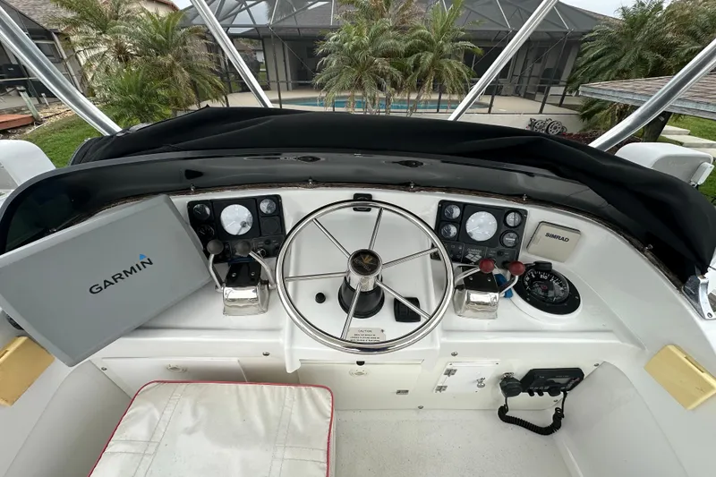 Slide: The Image of 1975 Bertram 31 boat helm with Garmin navigation and Simrad equipment. - 21