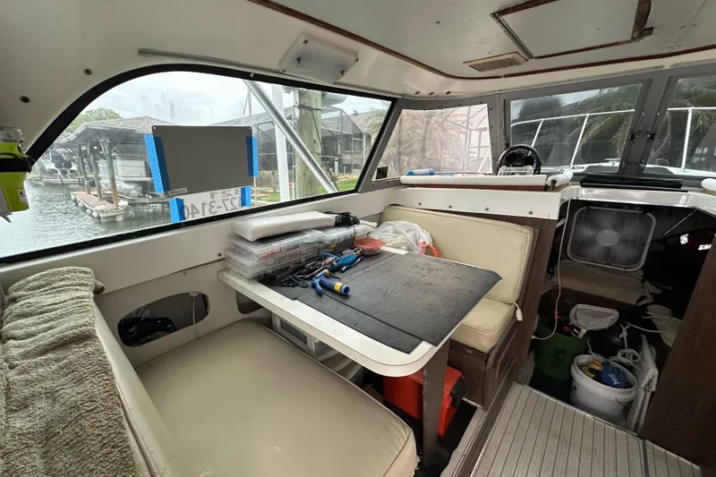 Slide: The Image of Interior of a 1975 Bertram 31 boat with seating and a work table. - 26