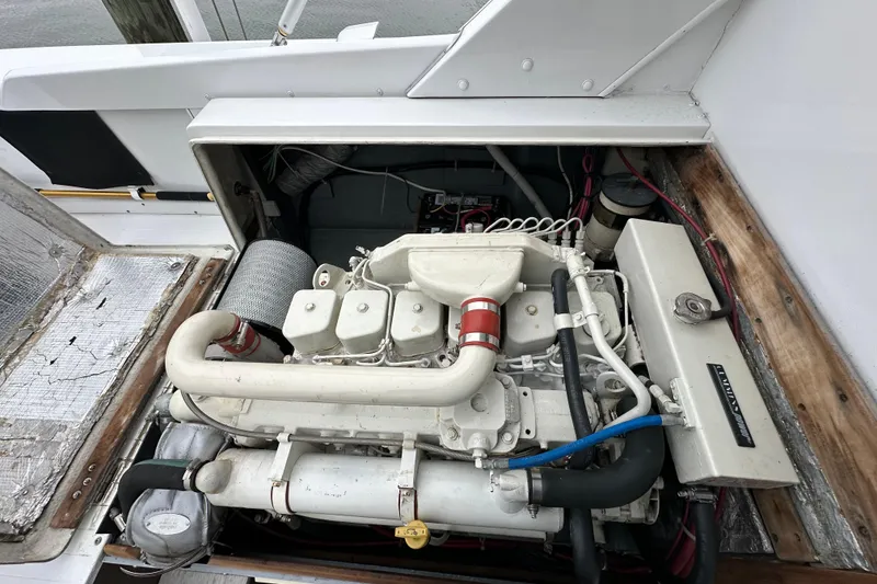 Slide: The Image of 1975 Bertram 31 engine compartment with visible components and wiring. - 45