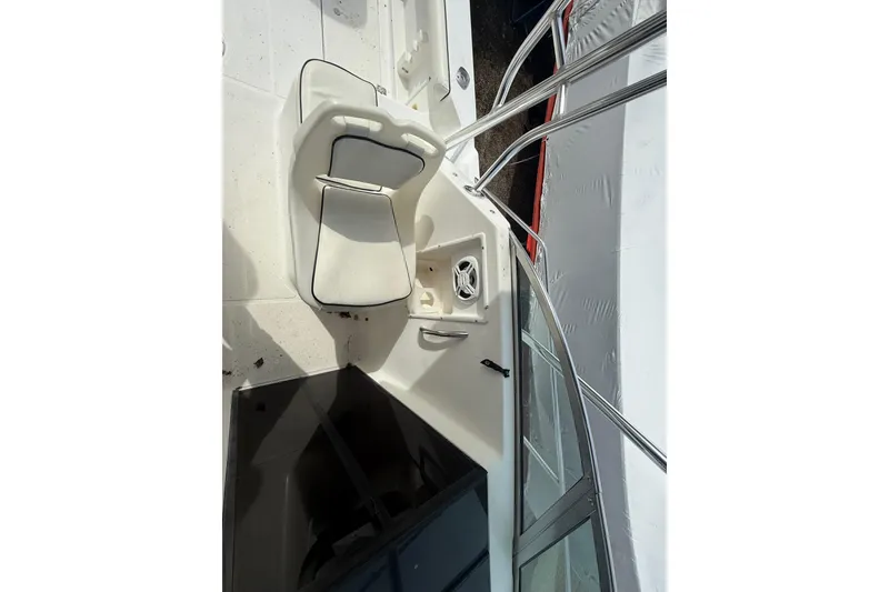 Slide: The Image of 2002 Wellcraft 22 Coastal Walkaround O/B boat interior with seating and railing. - 11