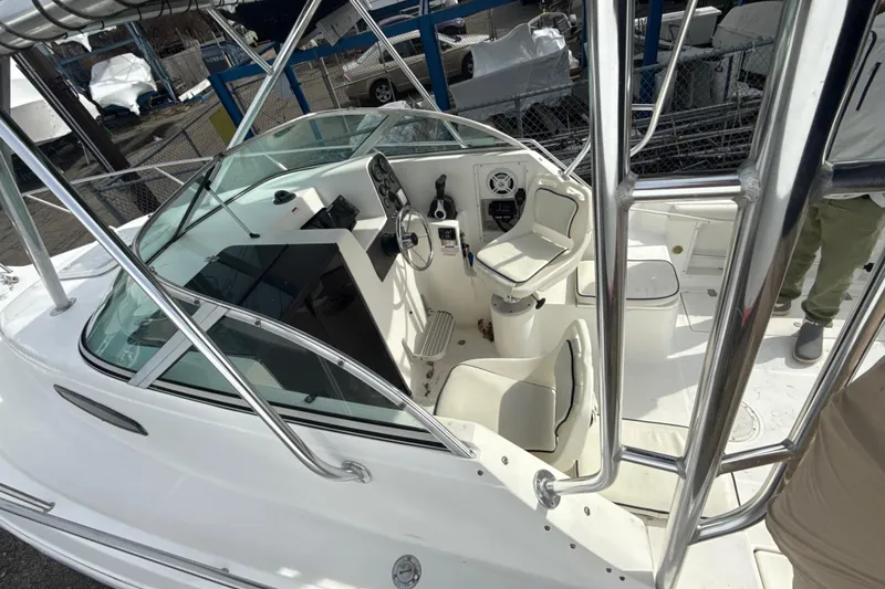 Slide: The Image of 2002 Wellcraft 22 Coastal Walkaround O/B boat interior with steering console and seating. - 12