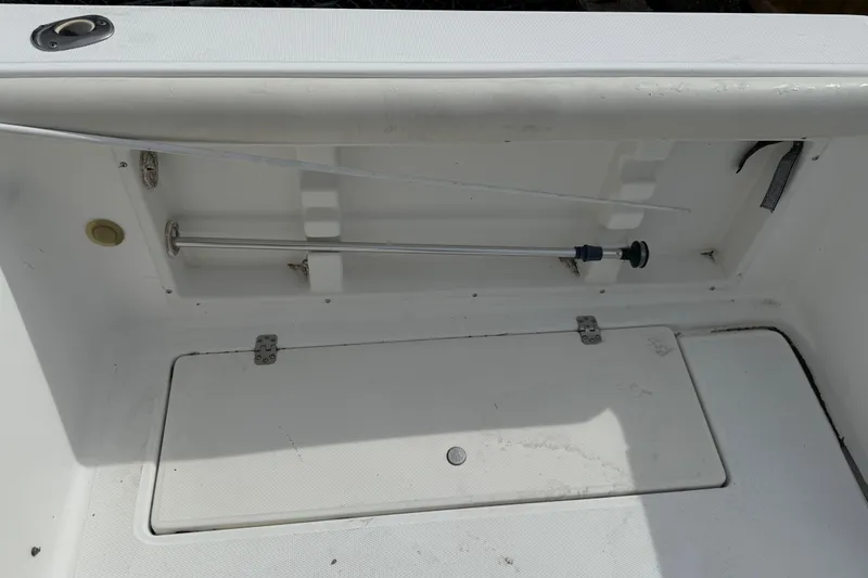 Slide: The Image of Storage compartment of 2002 Wellcraft 22 Coastal Walkaround O/B boat, featuring a clean interior. - 18