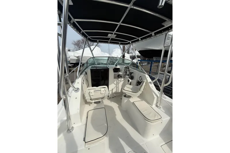 Slide: The Image of 2002 Wellcraft 22 Coastal Walkaround O/B boat interior with seating and steering console. - 3