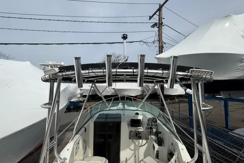 Slide: The Image of 2002 Wellcraft 22 Coastal Walkaround O/B boat with T-top and cockpit view. - 6