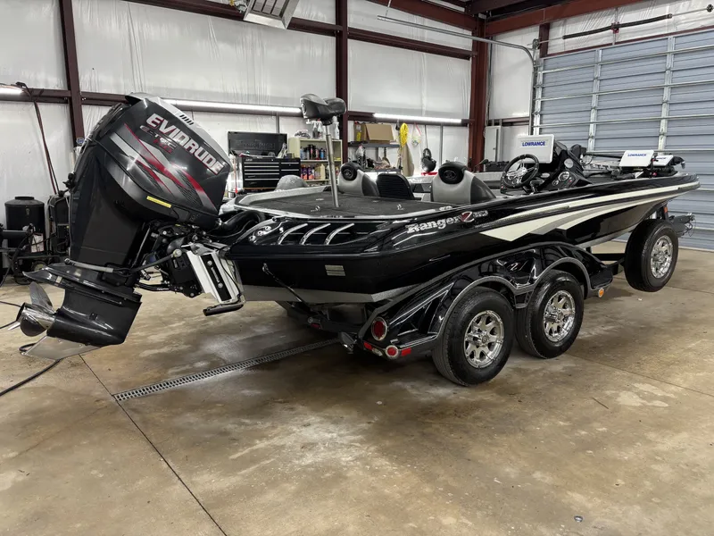 Slide: The Image of 2013 Ranger 520C boat with Evinrude motor in garage. - 4